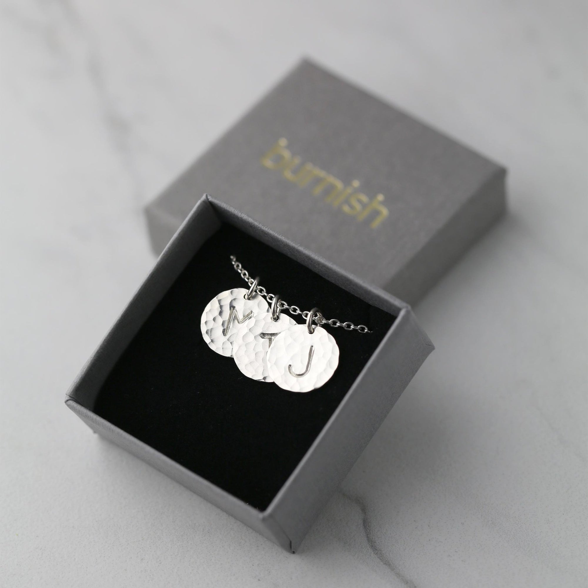 Hammered Silver Initial Disc Necklace jewelry handmade by Burnish