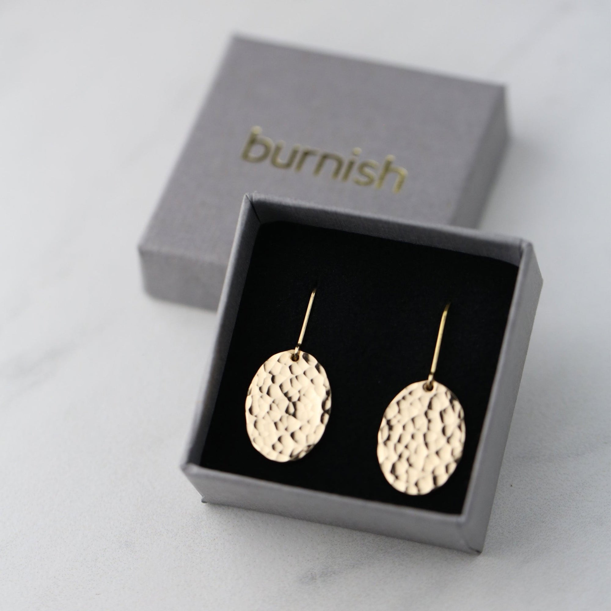 Oval Hammered Gold Lever-back Earrings handmade by Burnish