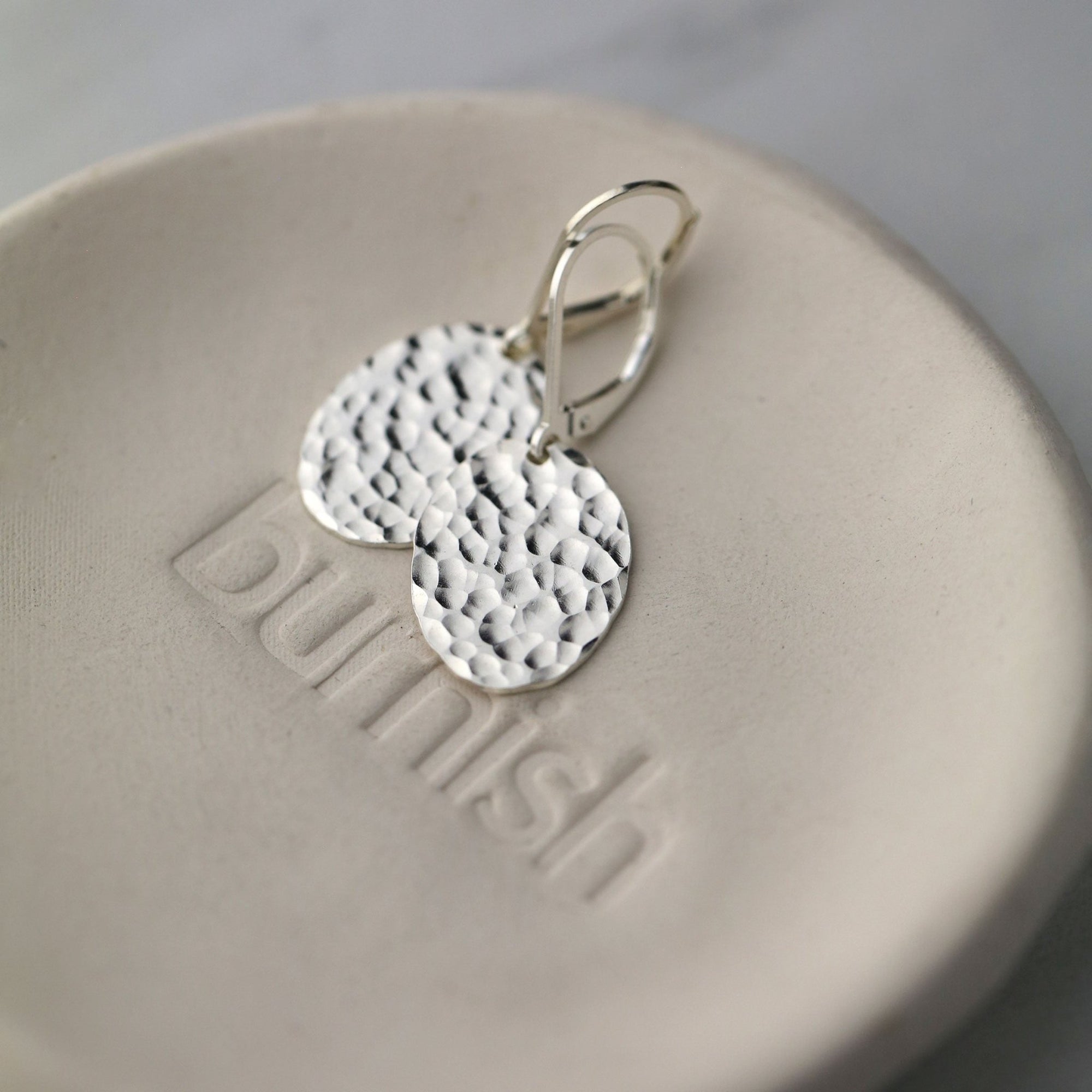 Oval Hammered Silver Lever-back Earrings handmade by Burnish