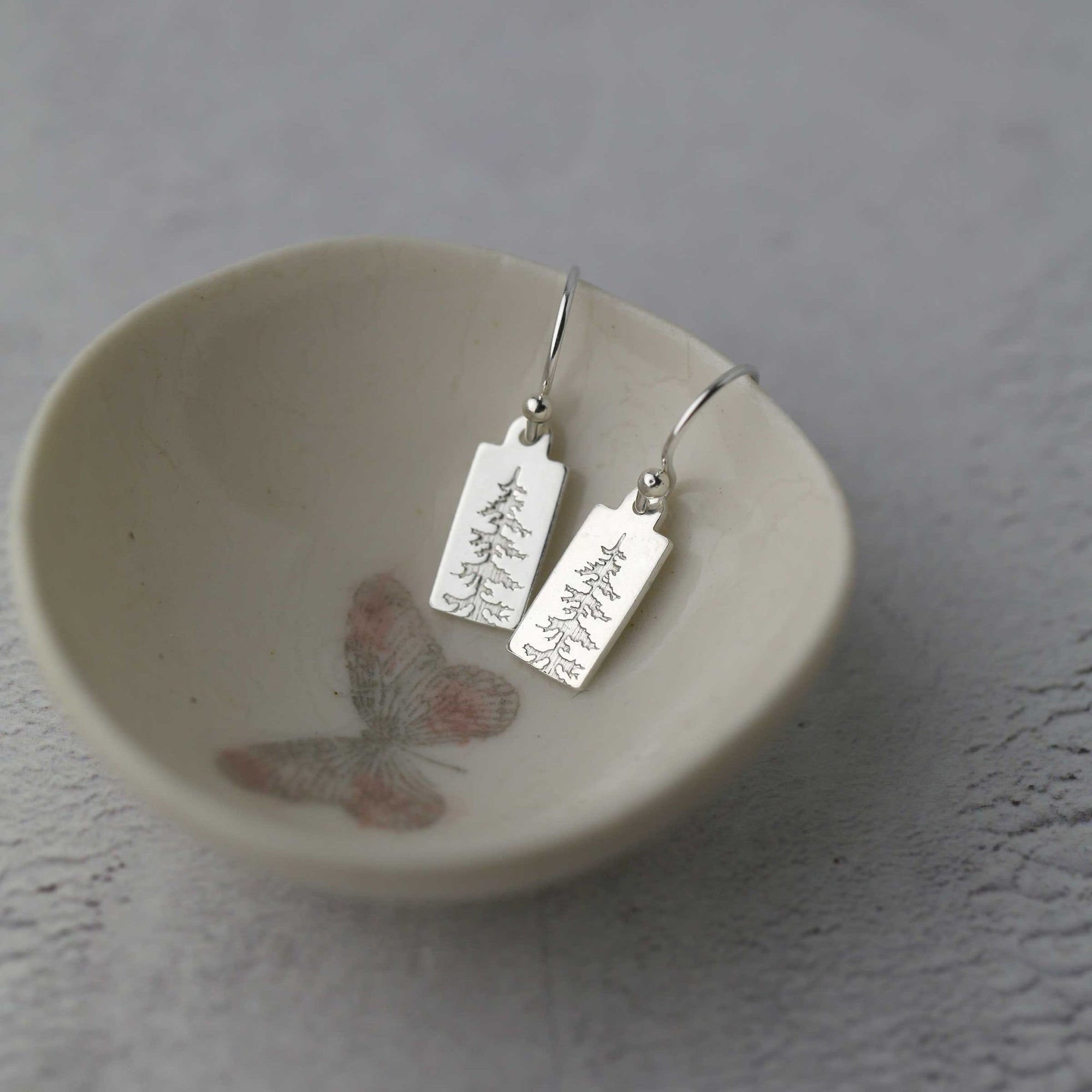 Mini Silver Evergreen Tree Tag Earrings jewelry handmade by Burnish