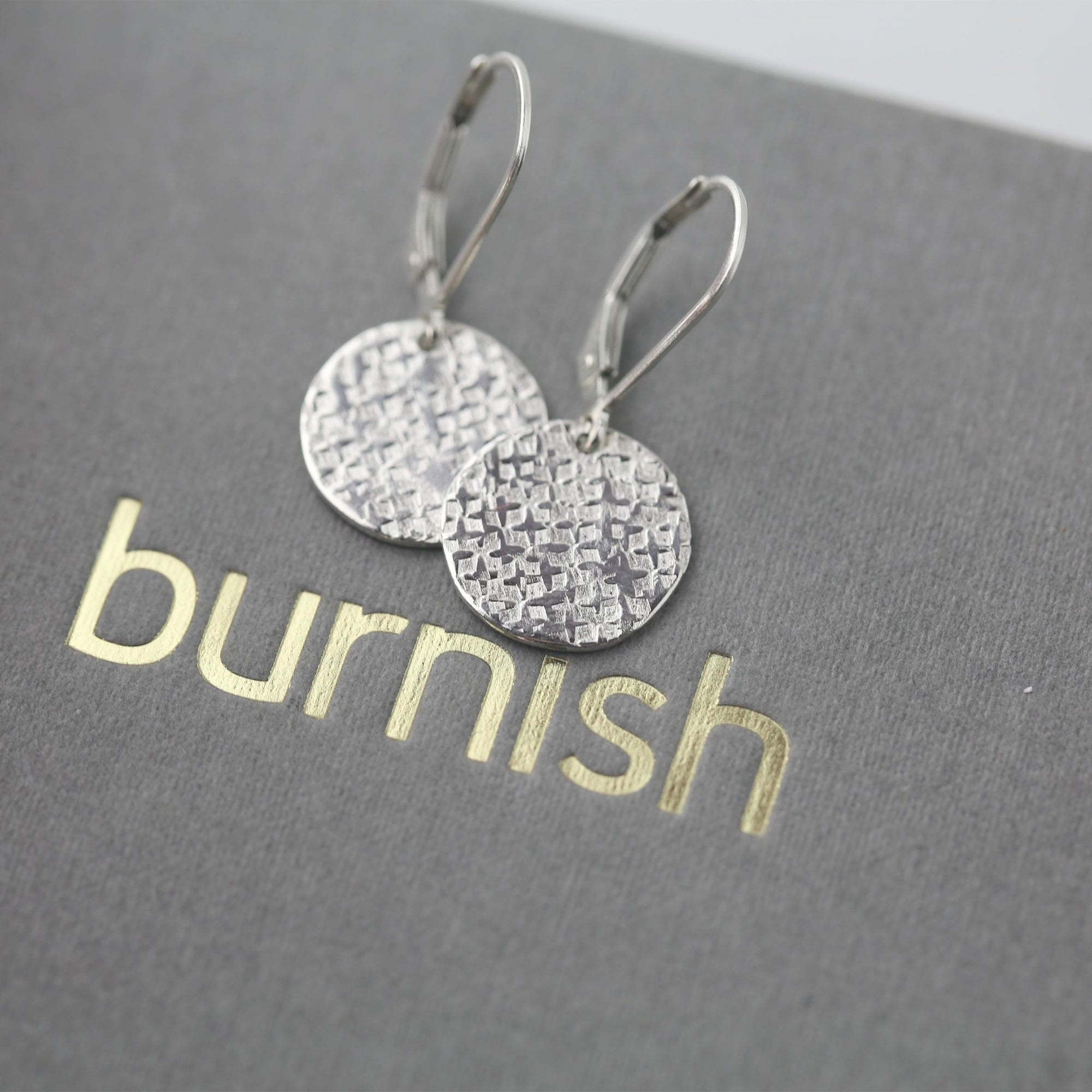 Silver Raw Silk Texture Disc Earrings jewelry handmade by Burnish