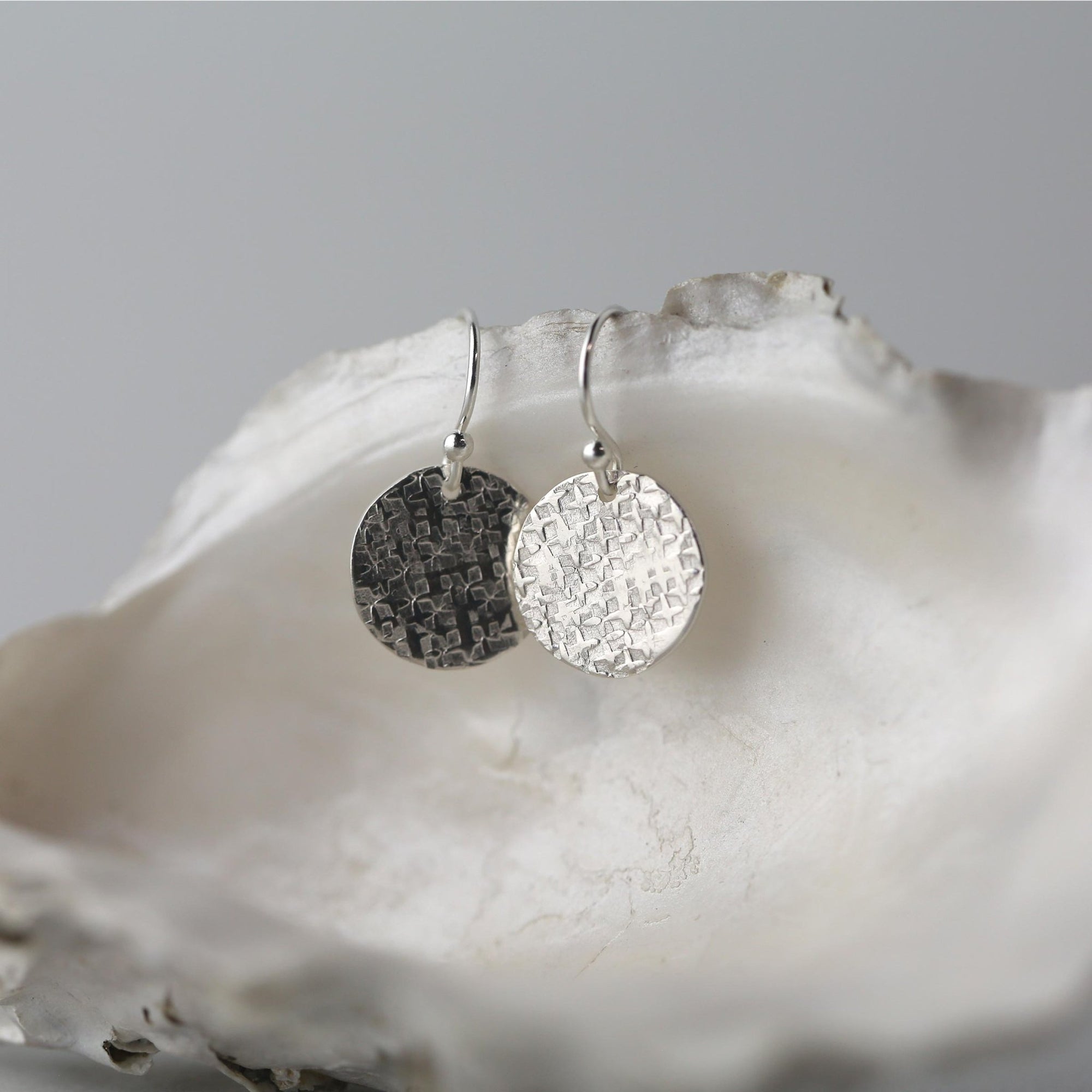 Silver Raw Silk Texture Disc Earrings jewelry handmade by Burnish